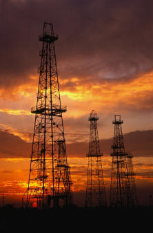Drilling Rigs at Sunset